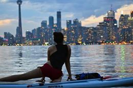 yoga class Toronto islands on stand-up paddleboard