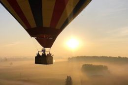 Calgary in a hot air balloon flying at sunrise.