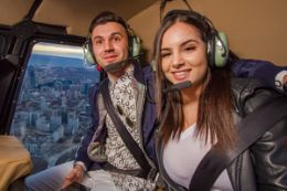 Private helicopter tour over toronto couple in cockpit