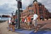 Group of people with guide on tour of microbreweries Denver.